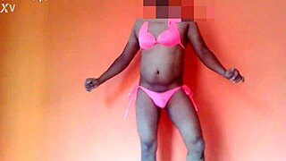 Girl shows off her moves in a hot pink two-piece
